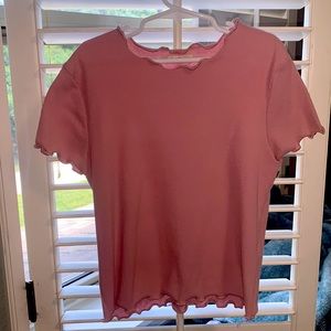 Medium light pink cropped tee.